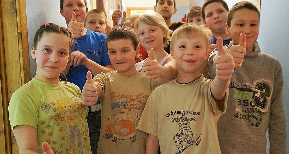 Children give a thumbs up Thumbs up from the orphans in Eastern Europe
